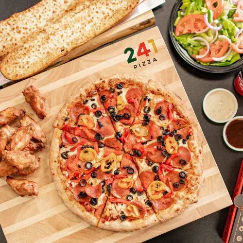 241 Pizza combo meal with pepperoni pizza, chicken wings, garlic bread, and fresh salad – proudly Canadian pizzeria.