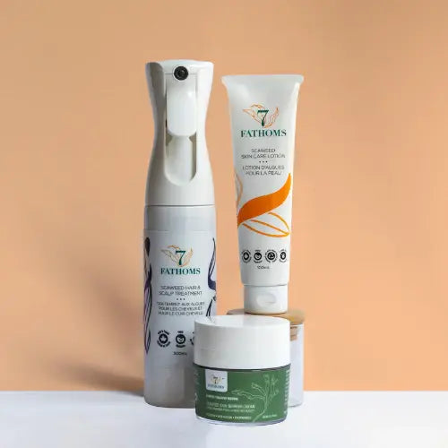 Three skincare products from Fathoms on a peach background