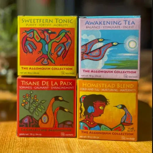Four boxes from The Algonquin Collection on a wooden surface with a blurred background