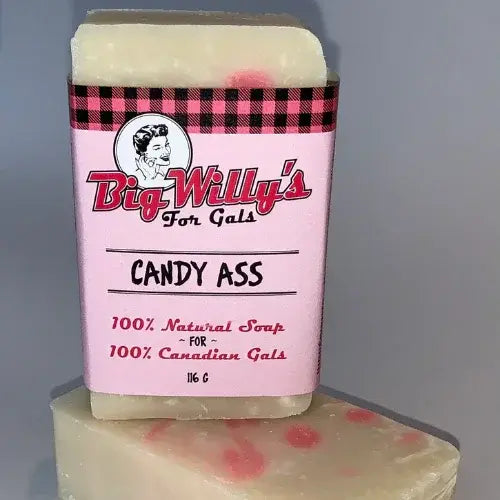 Bar of soap with a pink label featuring text and branding on a gray background