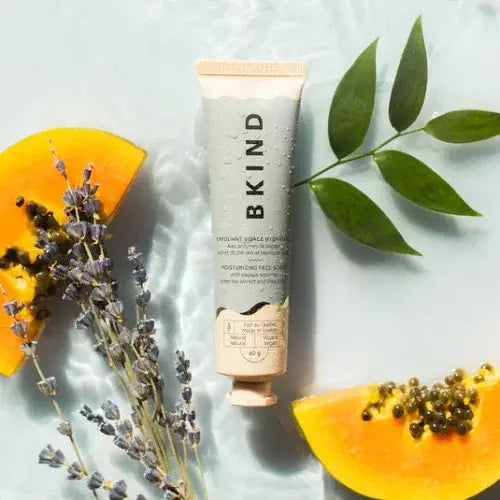 Skincare tube with papaya slices and lavender on a light background