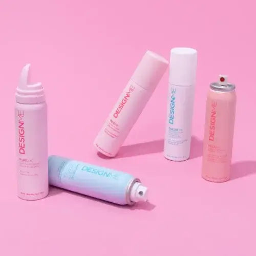 Hair care products on a pink background