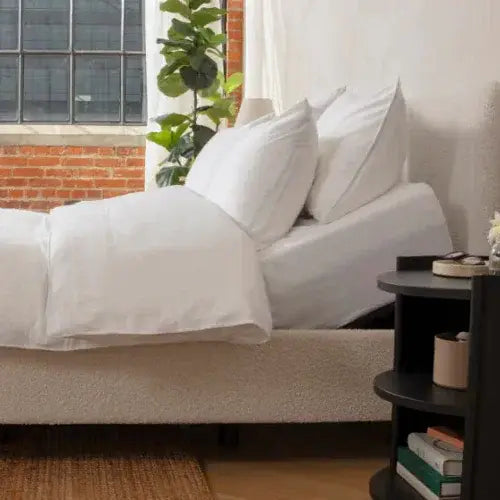Modern bedroom with a neatly made Endy mattress and white bedding – Canadian-owned brand known for comfort and sleep innovation