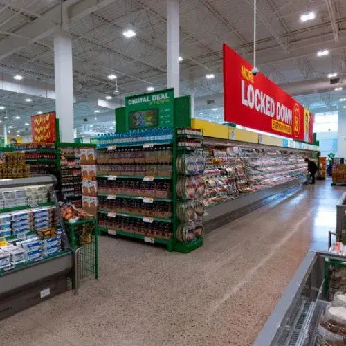 Food Basis supermarket interior with product shelves and signage.