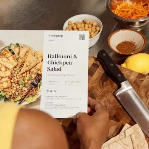 Fresh Prep Halloumi and Chickpea Salad meal kit with recipe card and prepped ingredients on kitchen counter