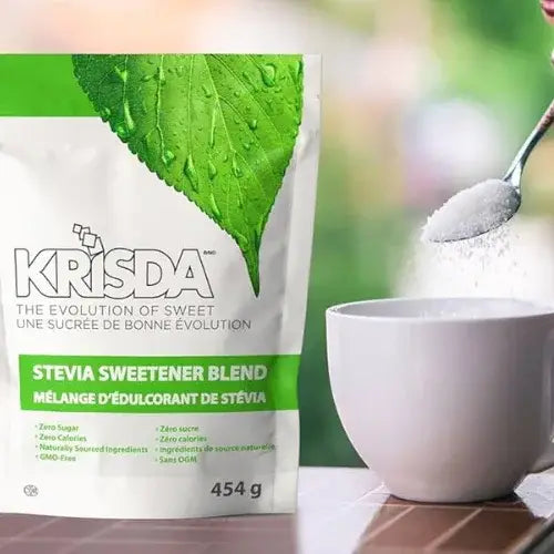 Krisda Stevia Sweetener Blend package with a white cup and spoon on a blurred background