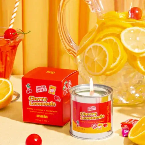 Cherry Lemonade themed candle and packaging with lemons and cherries on a yellow background