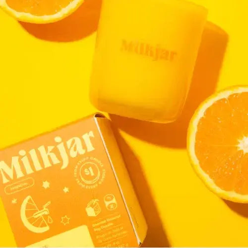 Milkjar product packaging with a slice of orange on a yellow background