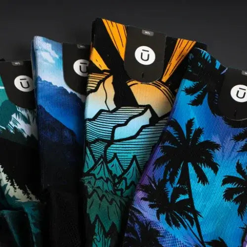 Collection of colourful socks with brand logo on a dark background