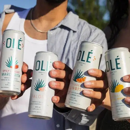 Four cans of OLE spicy margarita drinks