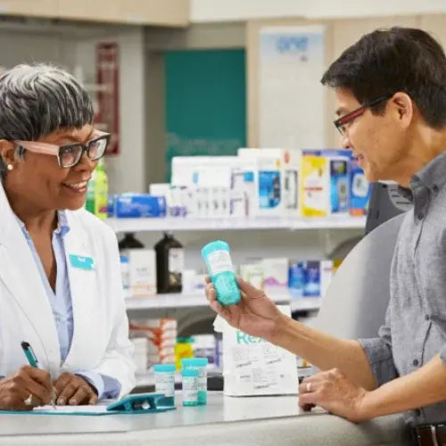 Pharmacist assisting a customer with a product in a pharmacy setting