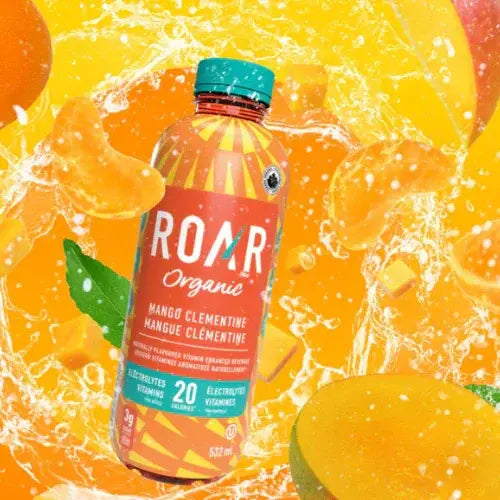 Bottle of ROAR Organic mango clementine juice with fruit slices and splashes in the background.