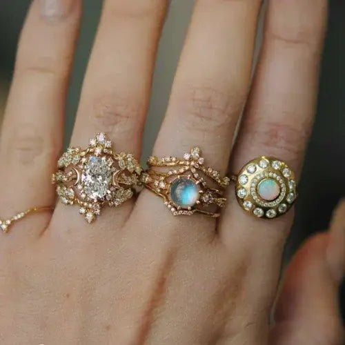Close-up of ornate gold rings with moonstones, opals, and diamonds – Ethereal, handcrafted fine jewellery by Canadian designer Sofia Zakia