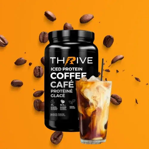 A black container of THRIVE Iced Protein Coffee sits beside a glass of iced coffee swirling with cream. Coffee beans are scattered around both products, all set against a vibrant orange background. The label highlights it as vegan, low in sugar, and high in protein.
