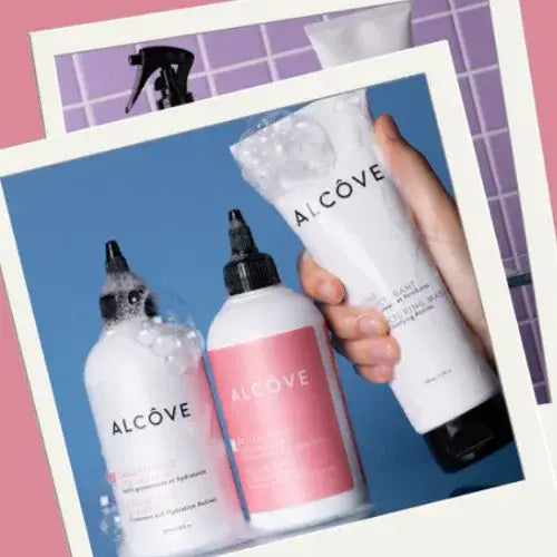 Alcove skincare products including bottles and a tube on a blue background.