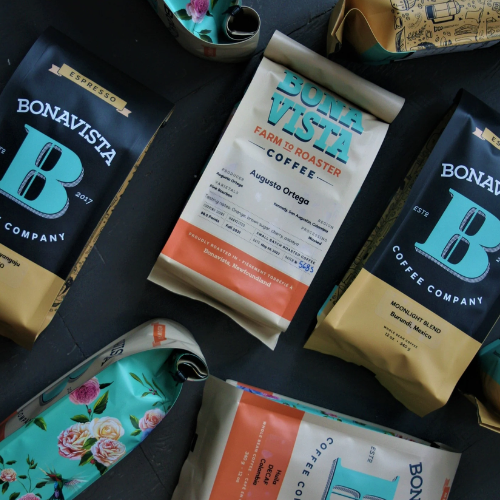 Bonavista Coffee Company packages on a dark surface with floral packaging.