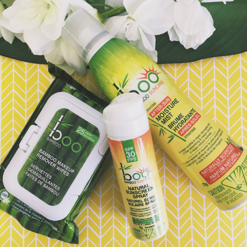 Boo Bamboo skincare products including wipes, spray, and after-sun lotion on a yellow patterned background.