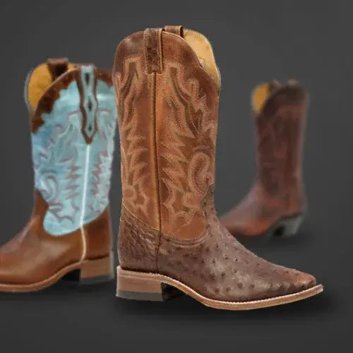 Three cowboy boots with intricate designs on a dark background