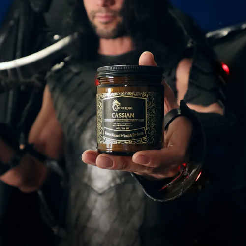 Person holding a jar labeled 'Cassian' against a dark background
