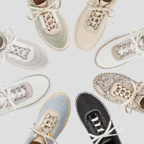 Collection of various sneakers on a light gray background