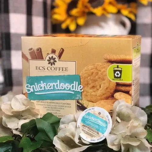 ECS Coffee Snickerdoodle packaging with a coffee pod on a decorative background