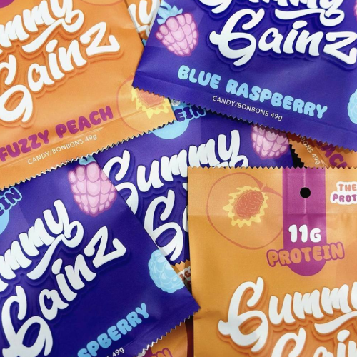 Colourful packages of 'Gummy Gainz' candy in various flavours.