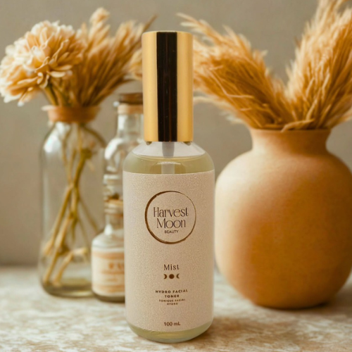 Harvest Moon beauty product bottle with decorative vases in the background