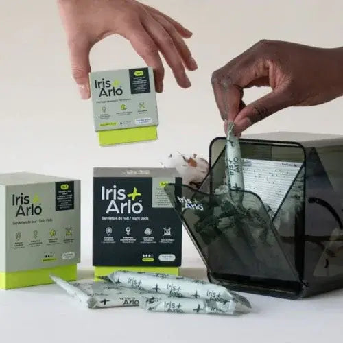 Iris + Arlo product packaging and usage on a white surface