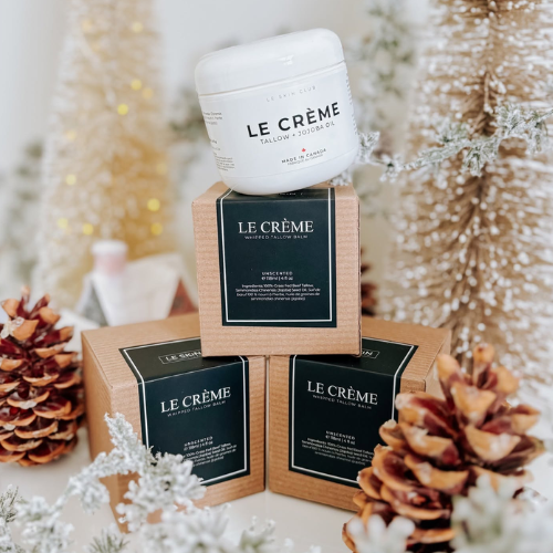 Le Creme products displayed with decorative elements on a blurred background