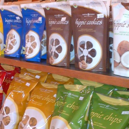 Display of 'hippie cookies' and 'hippie chips' packages on a shelf.