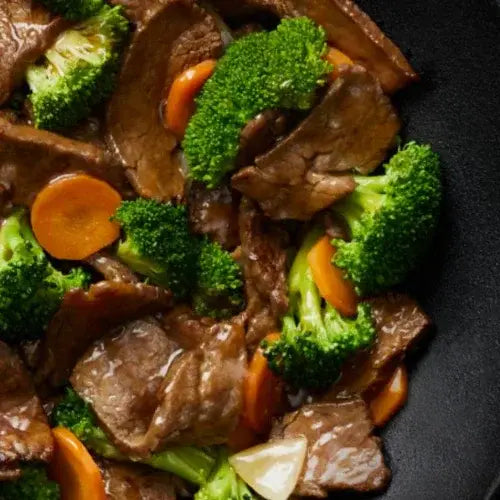 Beef stir-fry with broccoli, carrots, and savoury sauce from Canadian-owned Manchu WOK restaurant