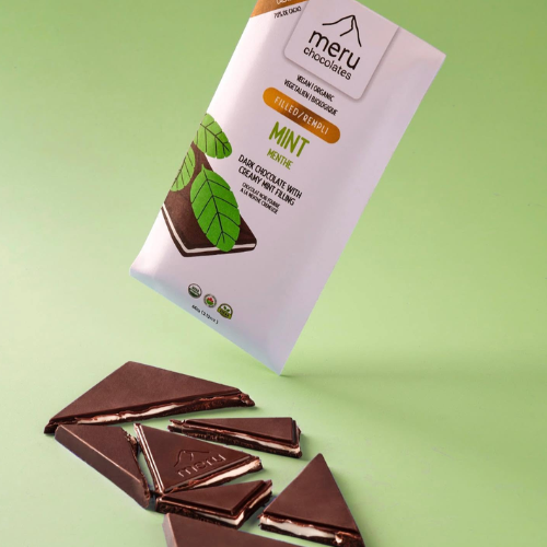 Meru Chocolates mint chocolate bar packaging with pieces of chocolate on a green background