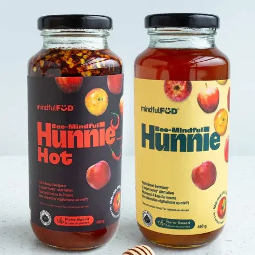 Two jars of 'Bee-Mindful Hunnie' on a light gray background