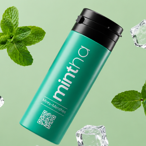 Green bottle labelled 'mintha' with mint leaves and ice cubes on a green background