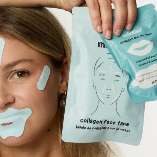 woman with face and mouth tape on holding up packets of mintier collagen face tape and collagen mouth tape