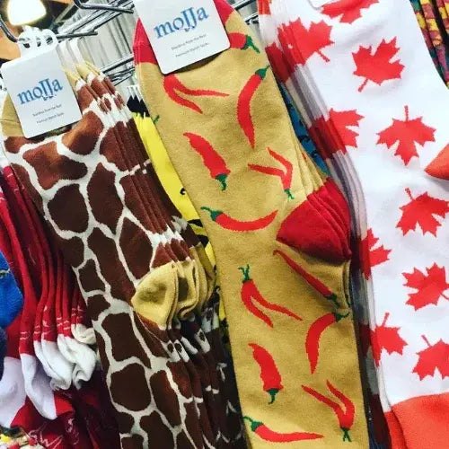 Collection of patterned socks with visible brand 'molla' labels.