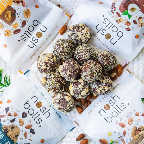 Nosh Balls snack balls with packaging on a light background