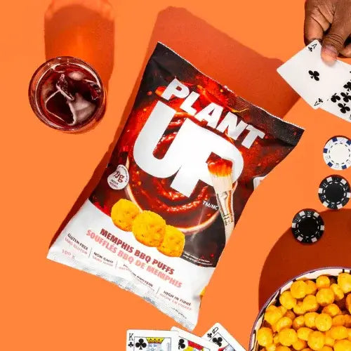 Packaged food with 'Plant Up' branding on an orange background