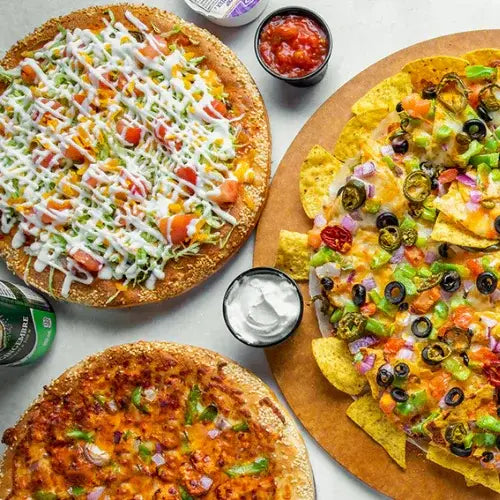 Red Swan Pizza with loaded toppings, creamy drizzle, and signature sesame crust – Canadian-owned pizzeria known for gourmet flavours.
