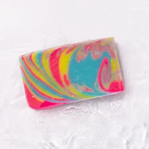 Colourful swirled soap bar on a white background