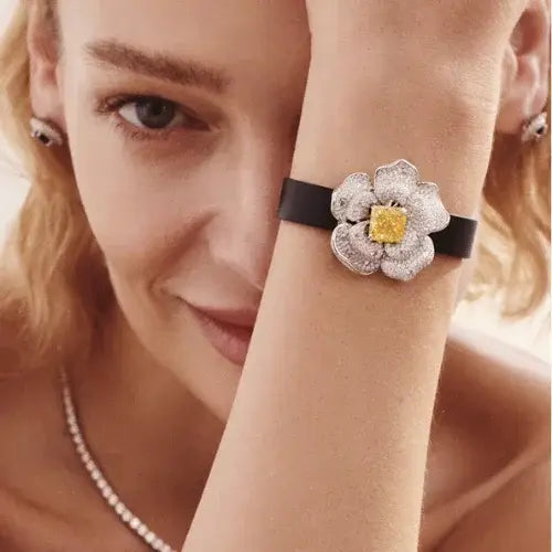 Woman wearing a luxurious floral bracelet with a yellow gemstone by Canadian-owned jewellery brand Stellar Adorn