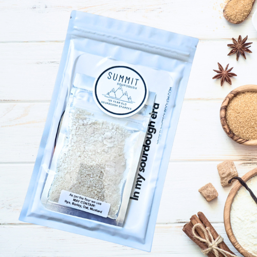 Summit Sourdough Yeast package on a wooden surface with cinnamon sticks and star anise.