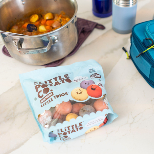 Packaged food with 'Little Potato Co.' branding on a kitchen counter.