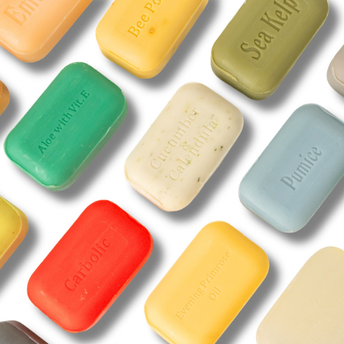 Assorted colourful soap bars on a white background