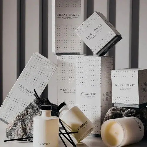 Collection of branded boxes and decorative items on a neutral background