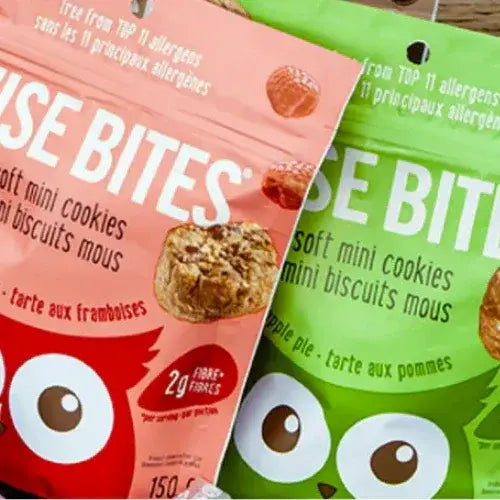 Two packages of 'Bite Bites' soft mini cookies, one pink and one green, with cookie images and text on the packaging.